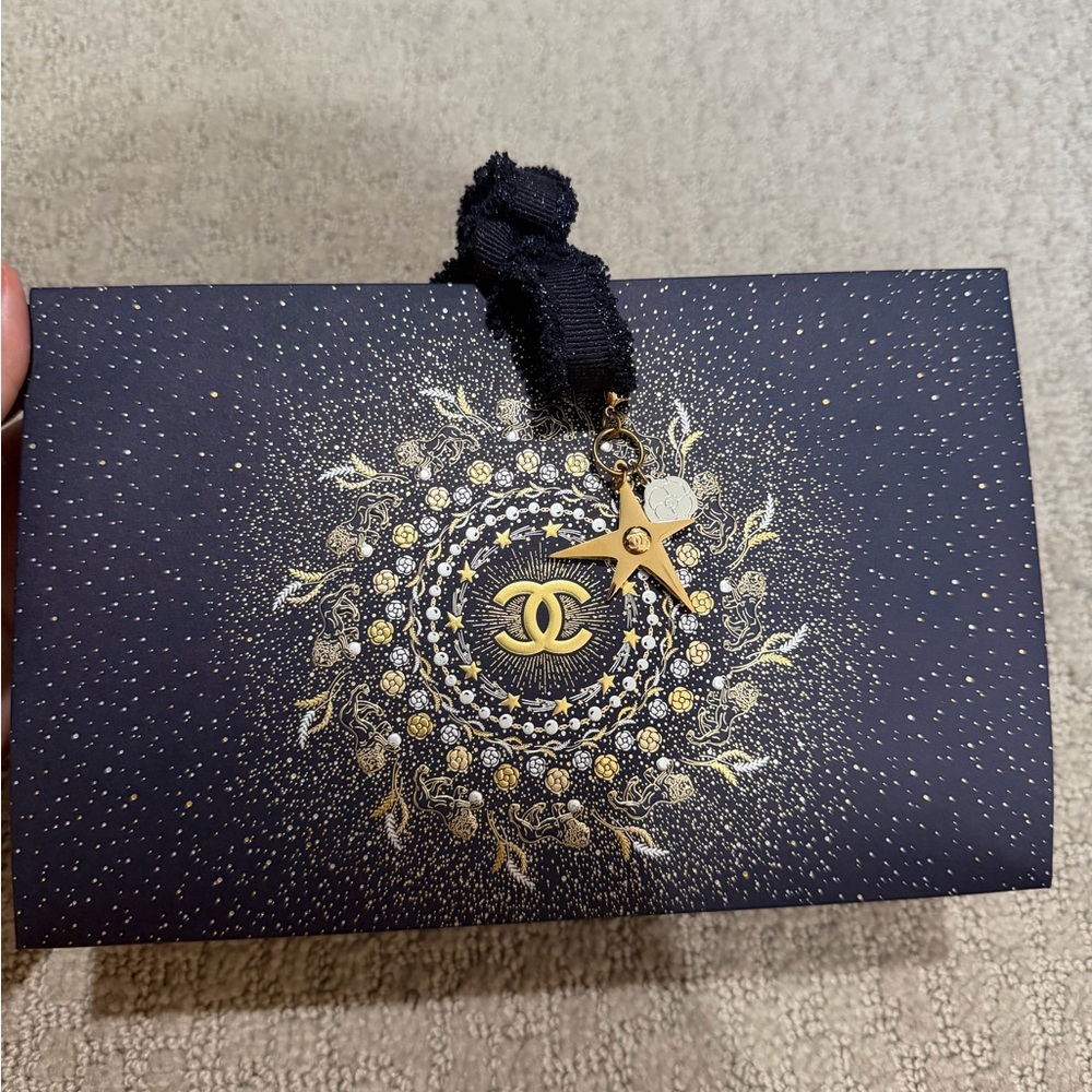 Chanel holiday package wrap with ribbon and pendant